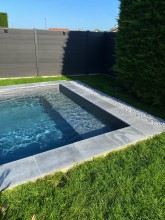 Construction d’une Piscine carré 4,5x4,5 avec Banquette Liner gris anthracite à Dommartin dans l’Ouest lyonnais